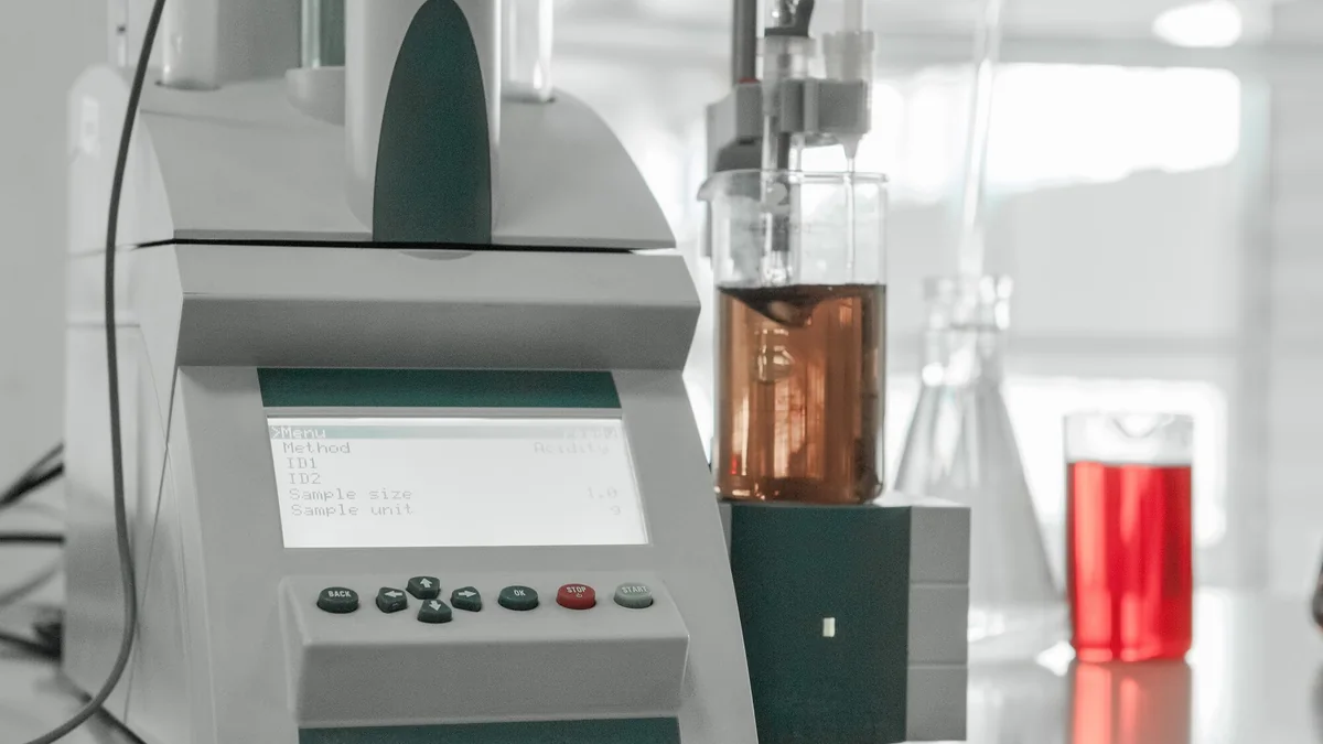 Analytical laboratory instrument measuring a prepared sample.